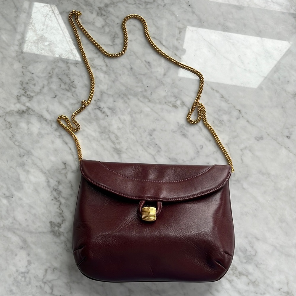 Vintage genuine leather brown Susan Gail shoulder bag with gold chain strap.